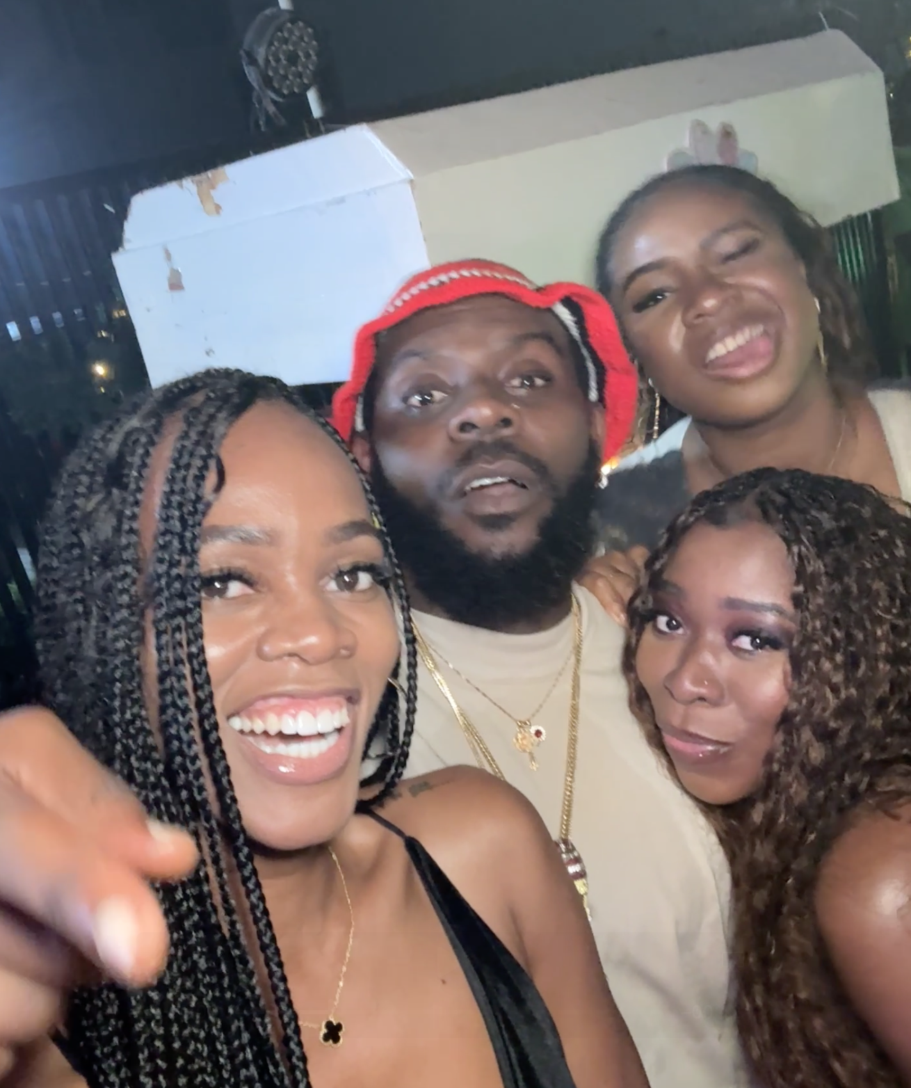 3 girls standing with Nigerian Afrobeats artist Odumodublvck